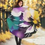 Woman with colorful umbrella in autumn park.