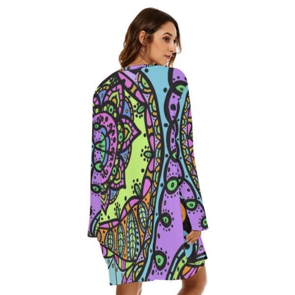 Woman in colorful mandala print dress.