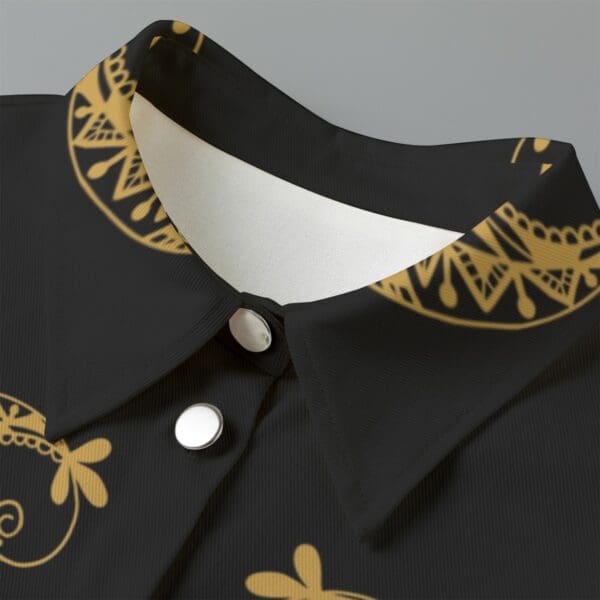 Black shirt with gold ornate pattern.