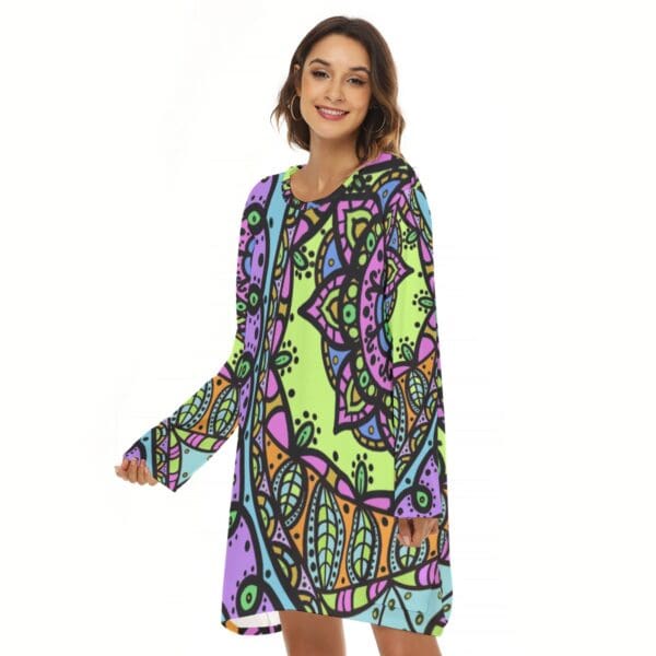 Woman in colorful mandala print dress.