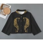Black cropped shirt with gold paisley design.