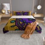 Colorful bed with abstract patterned bedding.