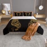 Black and gold bedding in modern bedroom.