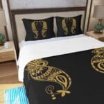 Black and gold paisley bedding design.