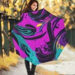 Woman with colorful umbrella in autumn setting.