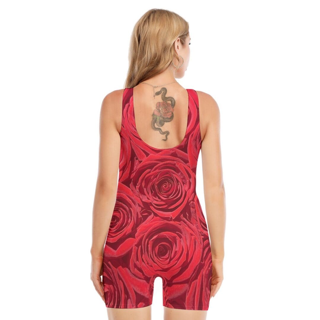 Woman in floral dress with back tattoo.