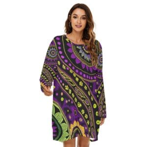 Woman wearing colorful patterned dress, smiling.