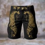 Black shorts with intricate gold patterns.