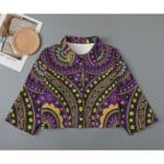 Colorful patterned shirt on gray background.