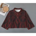 Red and black patterned button-up jacket.