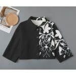 Black and white floral jacket on display.