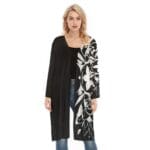 Woman wearing black floral-patterned cardigan.