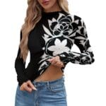 Woman in floral print black top.