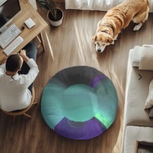 Man working at desk, dog nearby on floor.