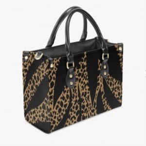 Leopard print handbag with black handles.