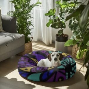 Dog on colorful bed in sunny room.