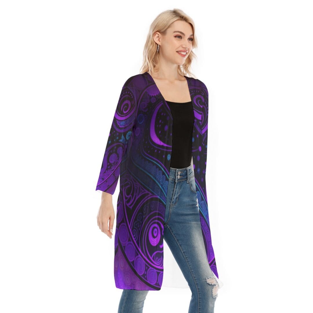 Woman in vibrant purple patterned cardigan.
