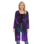 Woman wearing purple patterned long cardigan.