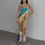 Woman in colorful dress with slit.
