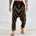 Man wearing harem pants with leopard pattern.