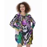 Woman wearing colorful leopard print dress.