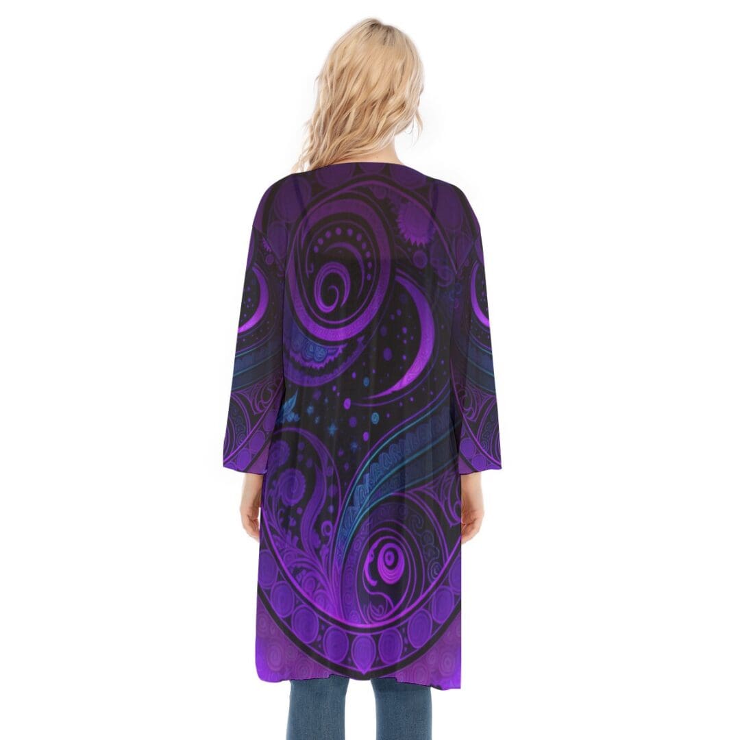 Woman wearing purple patterned long jacket.
