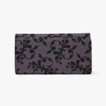 Purple wallet with black floral pattern.
