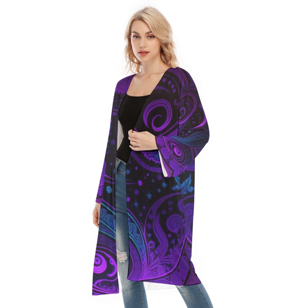 Woman wearing a purple patterned long cardigan.