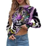 Woman wearing colorful leopard print top.