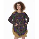 Woman wearing colorful patterned dress, smiling.