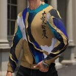 Man wearing colorful abstract-patterned sweatshirt.