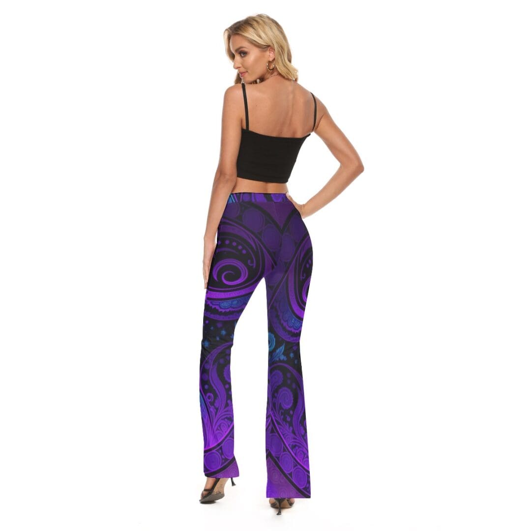 Woman wearing purple patterned pants, black top.