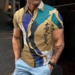 Man wearing colorful shirt with abstract design.