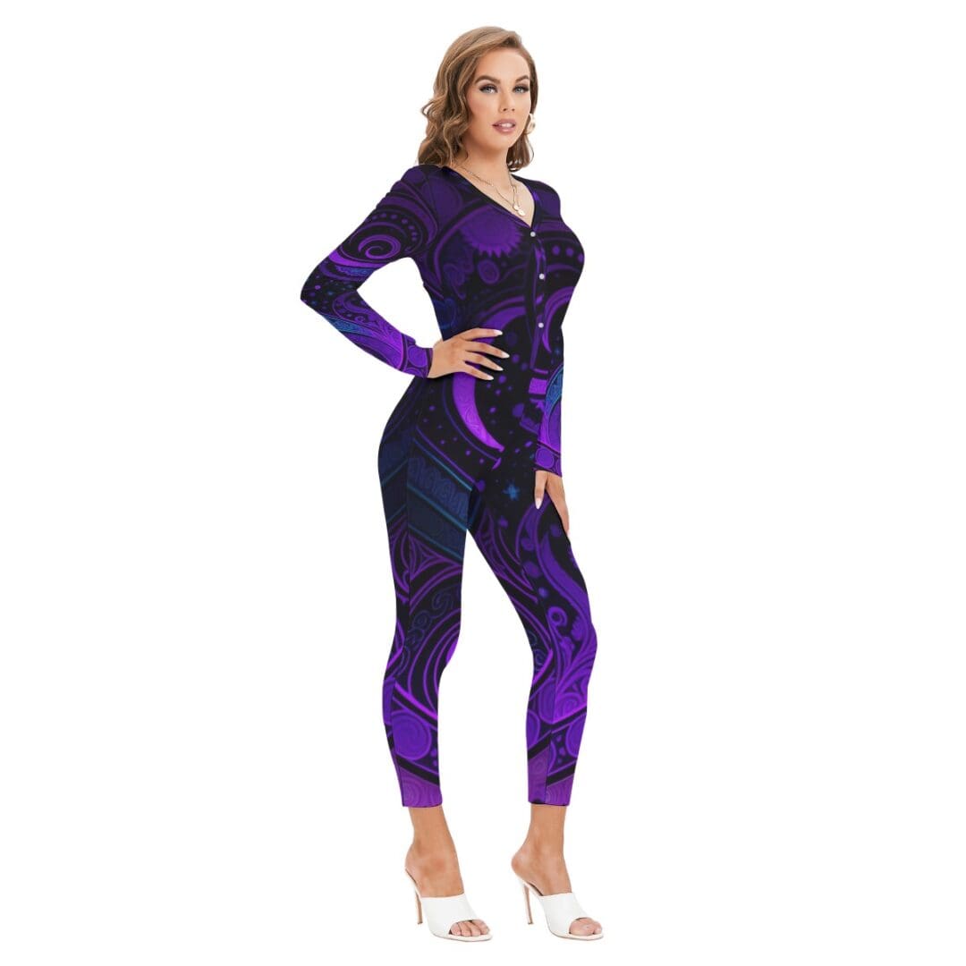 Woman in purple patterned jumpsuit and heels.
