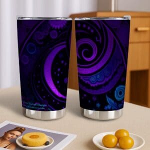 Purple patterned tumblers on wooden table.