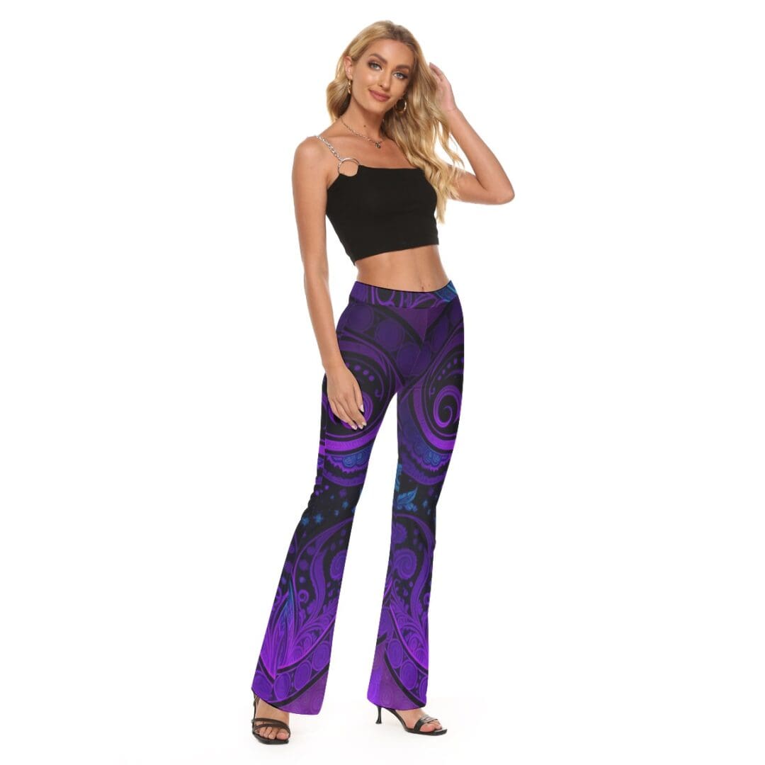 Woman in black top and purple pants.