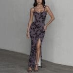 Woman in floral dress with slit.